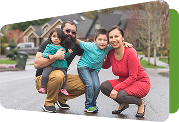 latinx family smiling in their neighborhood